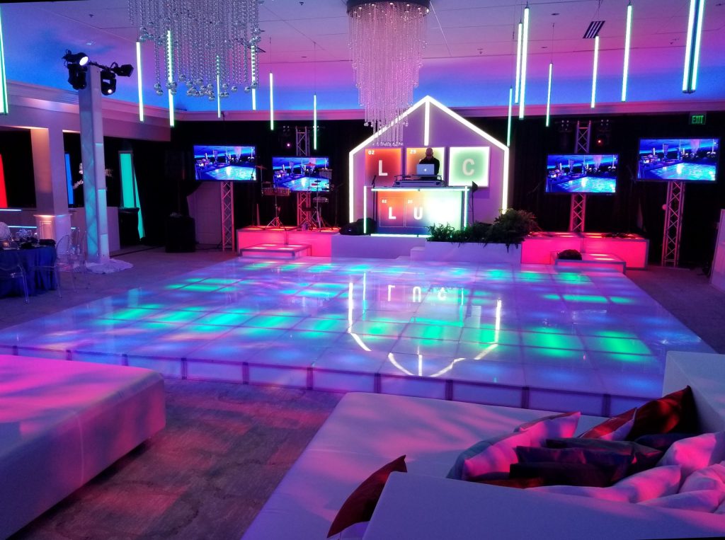 Illuminated LED dance floor setup with vibrant lighting and DJ booth by NYX Entertainment, showcasing the ideal dance floor design for weddings, mitzvahs, and corporate events in Maryland and the DMV.