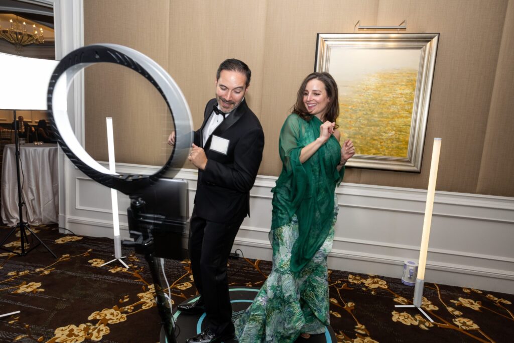 A 360 video booth is an interactive experience where a high-definition camera on a motorized arm orbits a platform to capture high-energy, slow-motion videos.