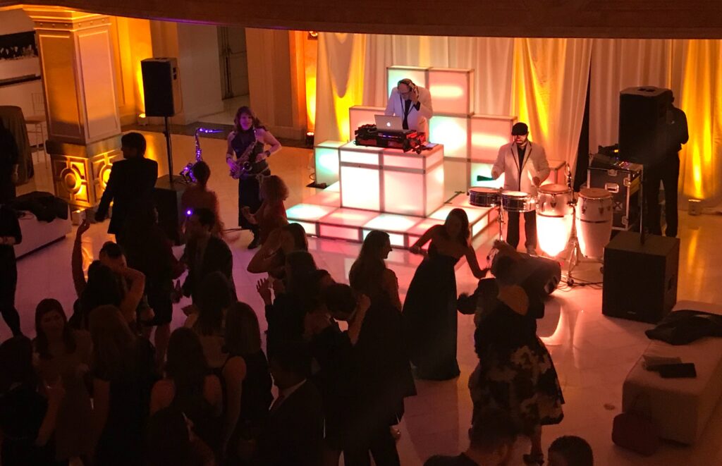 Howie Teger being a DJ in a corporate event.